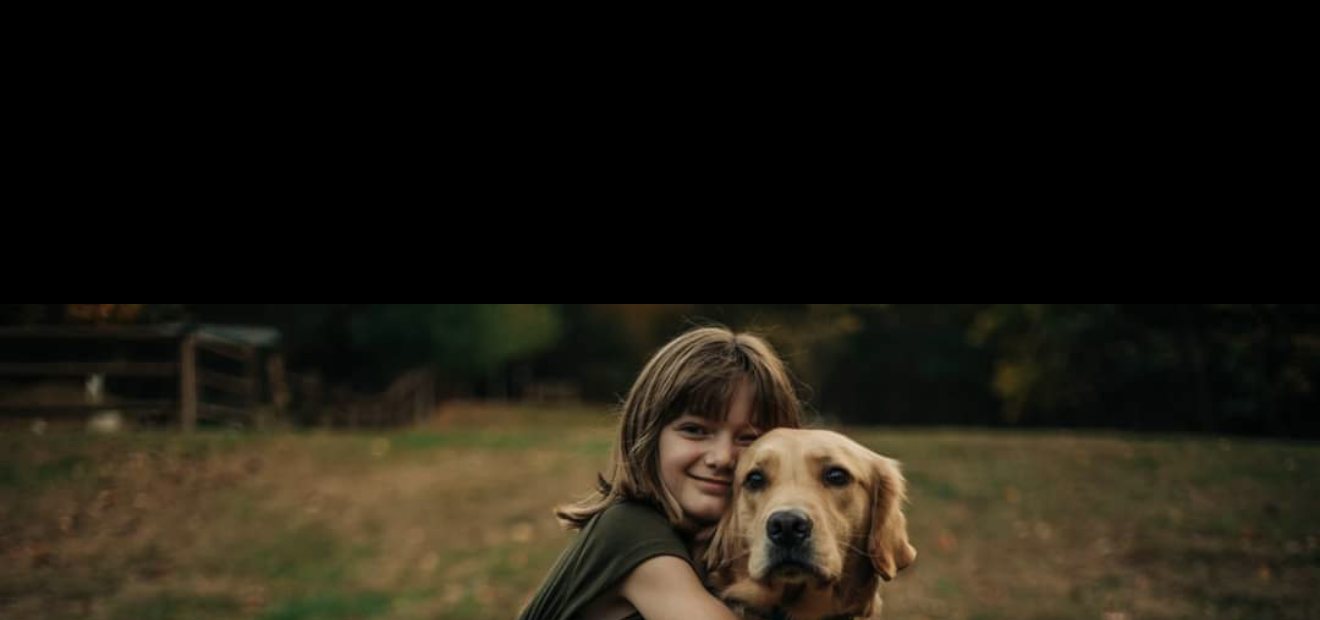 A girl hugging a golden retriever